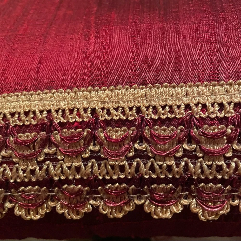 Decorative Pillow - 16”x16” - red (leaning a little burgundy) with gold trim